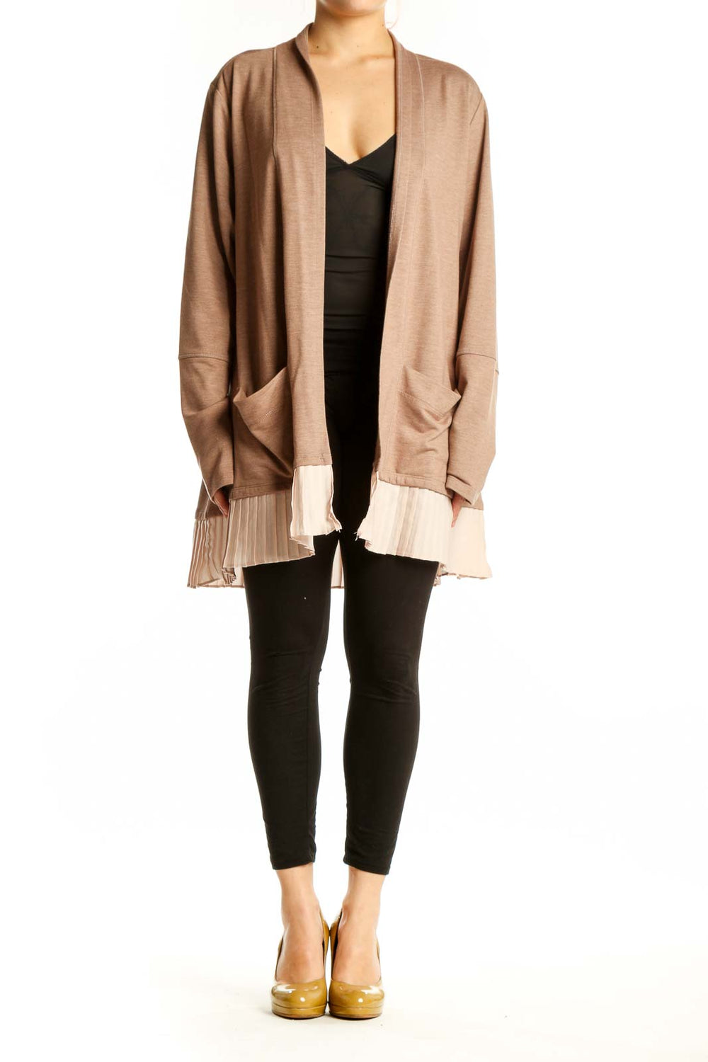 Beige open-front cardigan with pleated cream hem worn over black top, front view