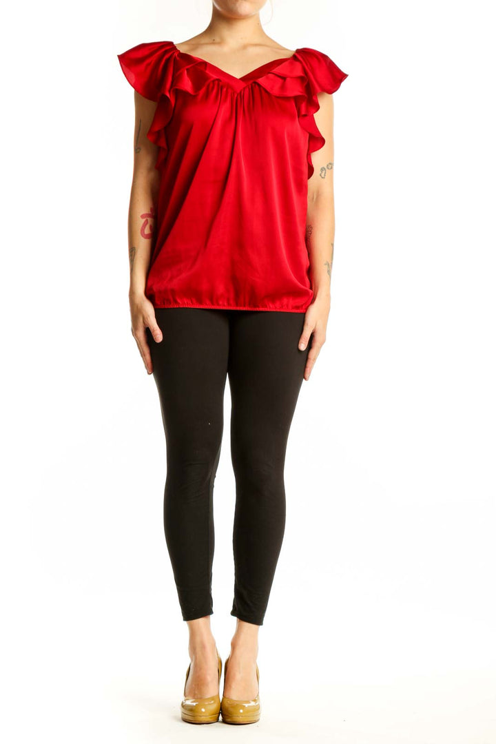 Red ruffle off-shoulder blouse with dramatic cap sleeves and gathered waist, front view