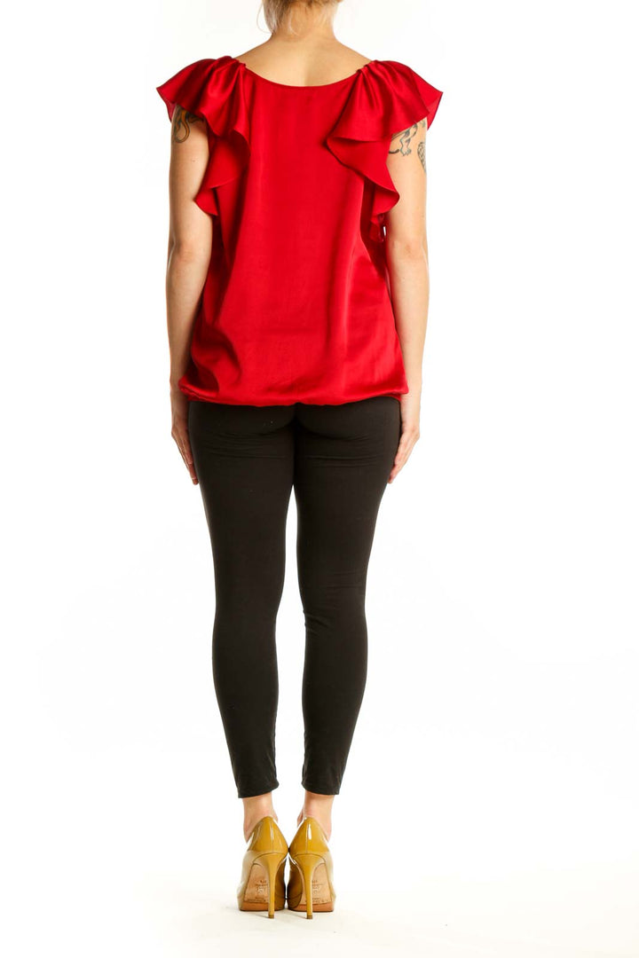 Red ruffle off-shoulder blouse with ruffled sleeves and gathered waist, back view