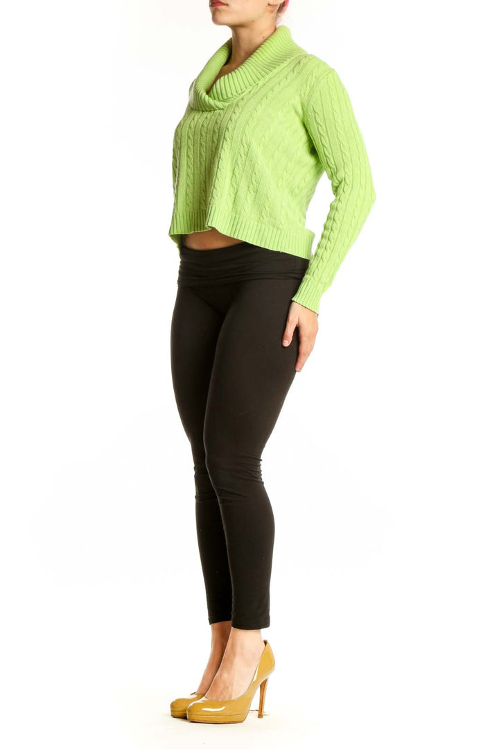 Lime green cashmere silk cowl neck sweater with cable knit pattern, cropped silhouette, worn with black pants