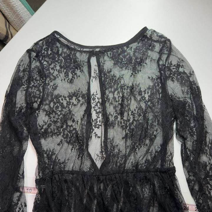 Black lace long sleeve maxi dress with floral overlay and pleated detail, back view