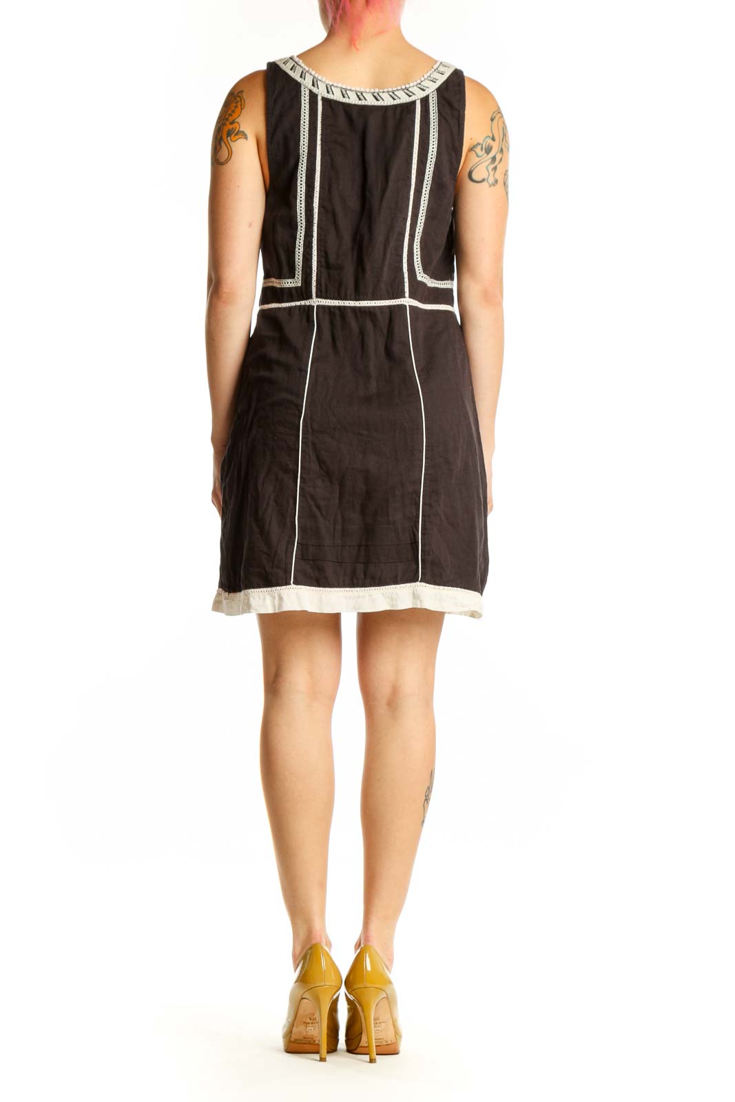 Black cotton Free People dress with white embroidered back neckline and cream trim hem, back view