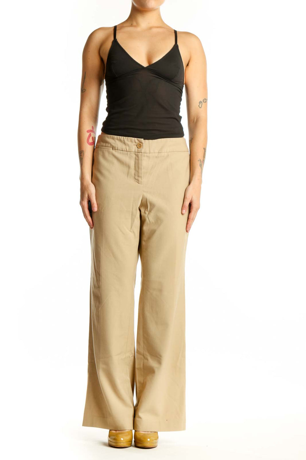 Beige wide-leg pants front view, showing classic button-front closure and relaxed fit
