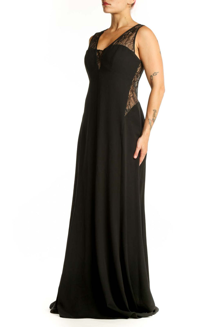 Black lace evening gown with V-neckline and lace shoulder detailing, front view