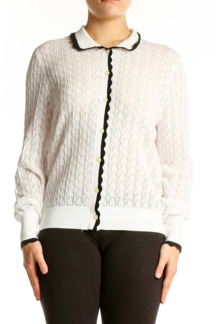 Cream cable knit cardigan with black contrast trim and Peter Pan collar, front view