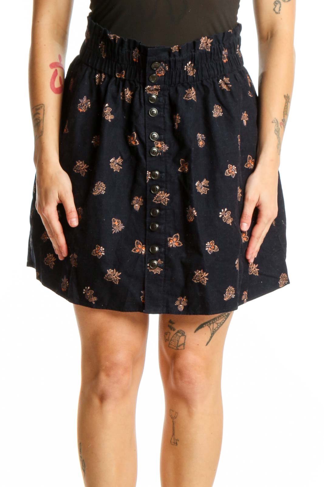Navy floral button-front shorts with rust and gold print, gathered waistband, and A-line cut
