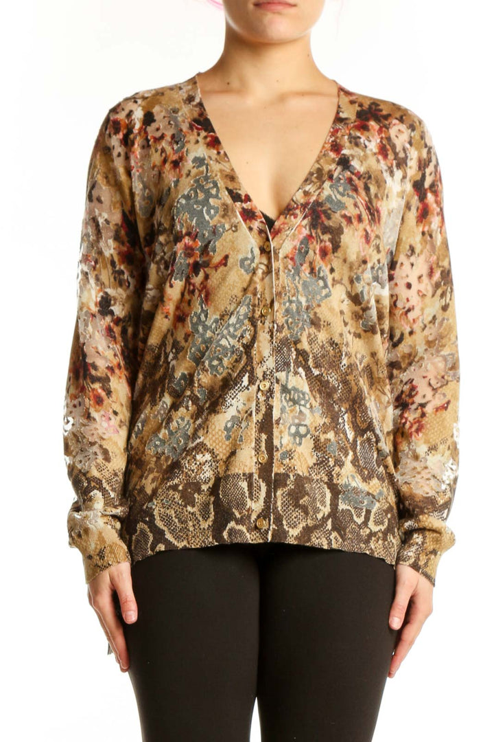 Beige floral and geometric patterned cashmere silk blouse with V-neckline and button-front closure, front view
