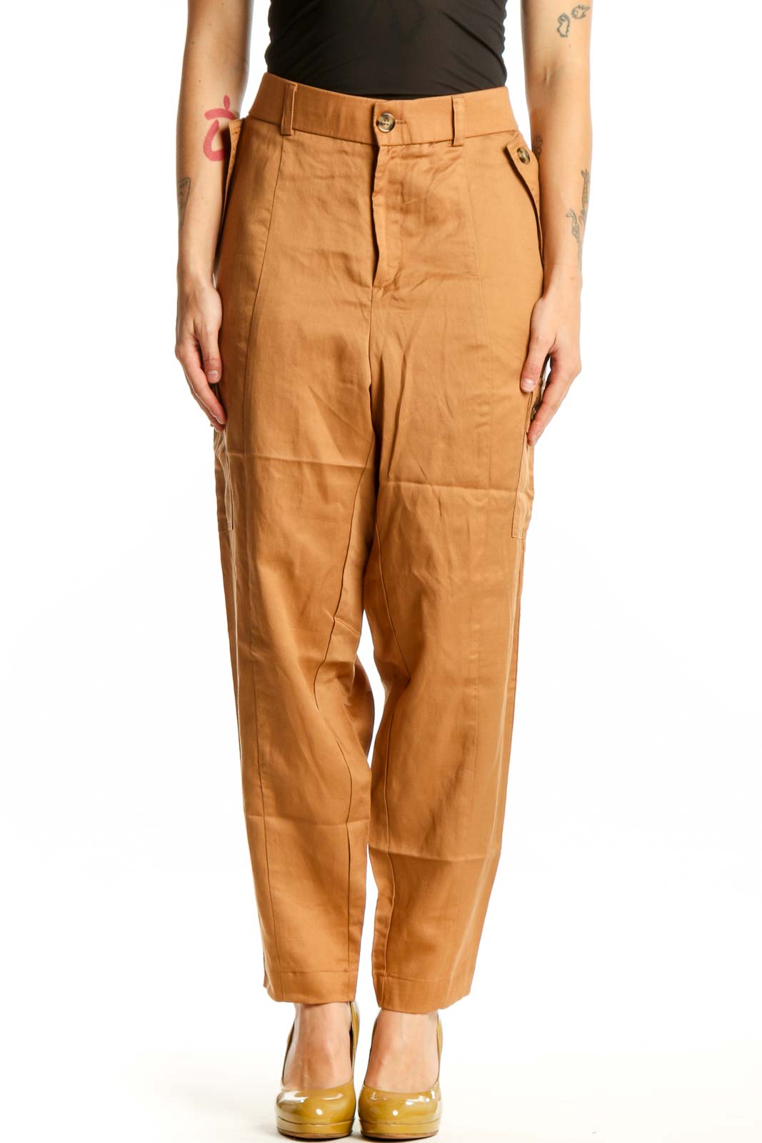 Front view of camel linen cargo pants with functional side pockets and high-waisted silhouette