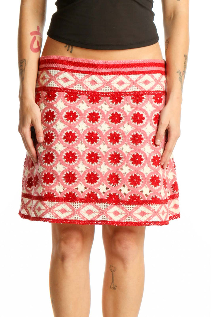 Red and cream floral A-line skirt with geometric border pattern, front view