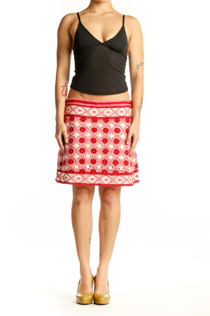 Red and cream floral A-line skirt with geometric border pattern, front view