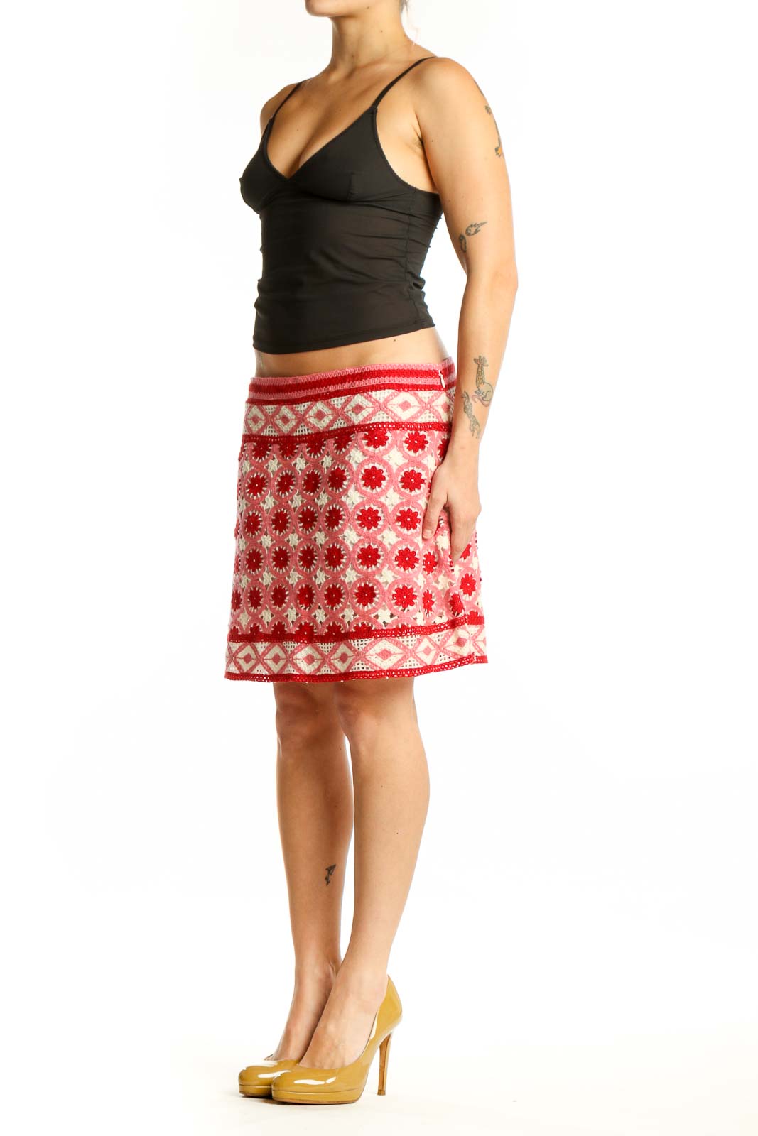 Red and cream floral A-line skirt with geometric border pattern, front view