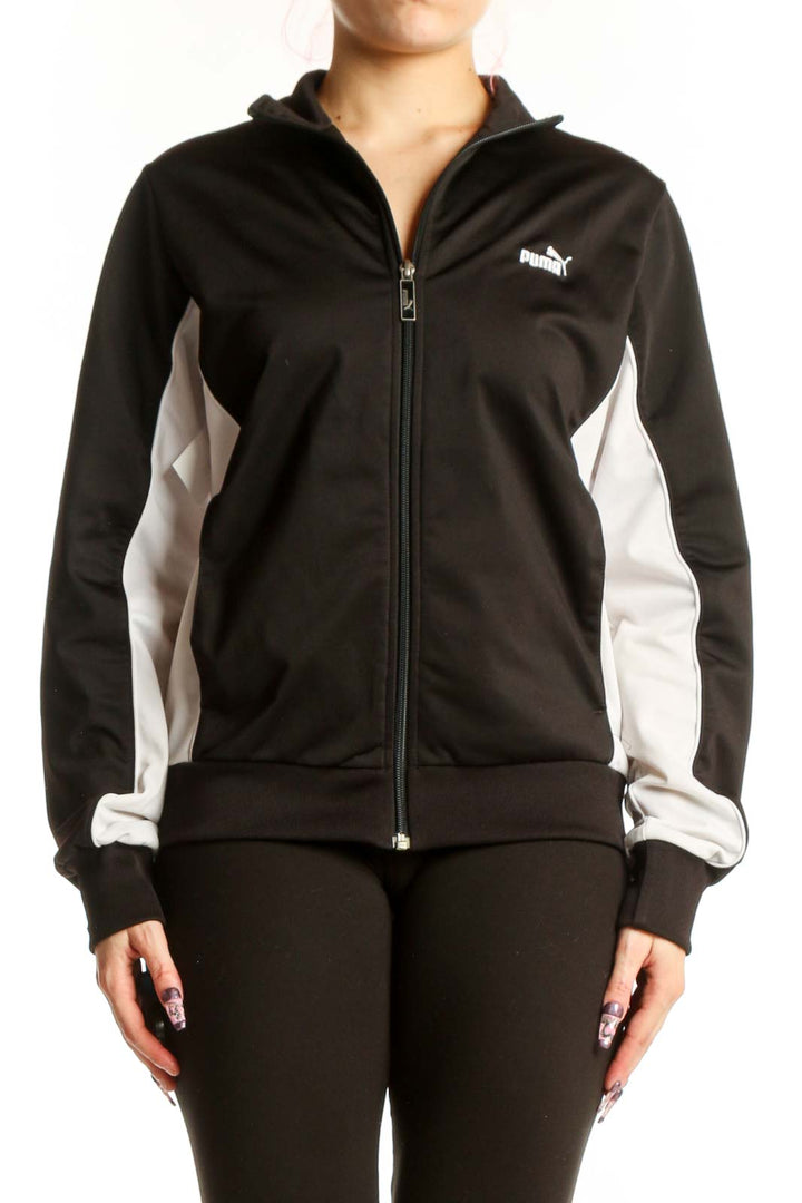 Black Puma Track Jacket with white contrast panels, full-length zip closure, and ribbed collar on model