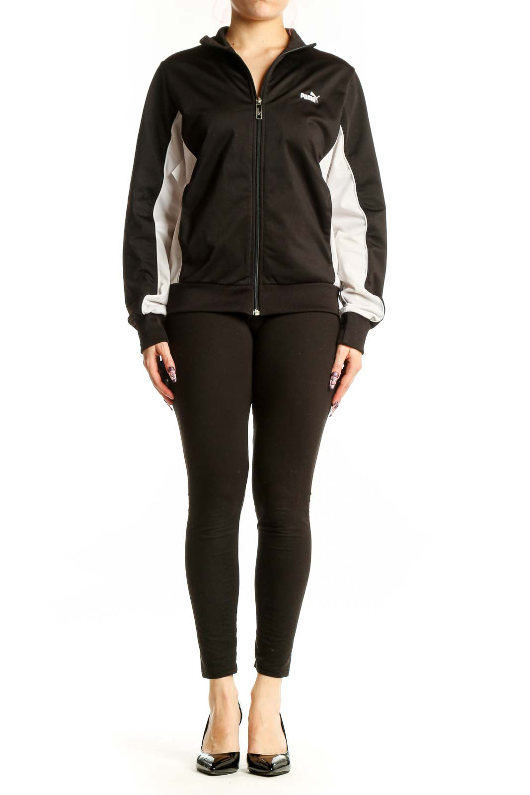 Black Puma Track Jacket with white contrast panels, full-length zip closure, and ribbed collar on model
