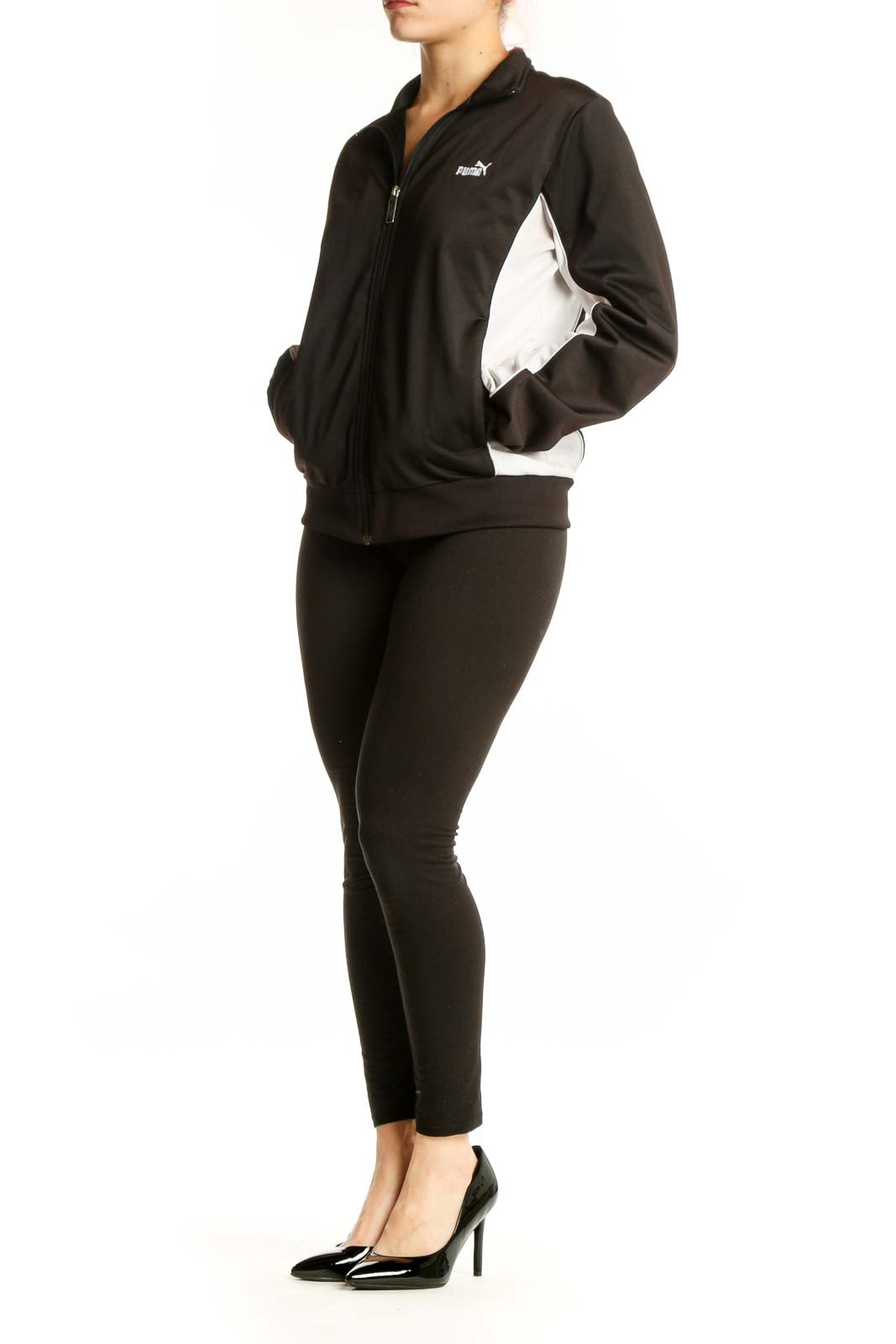 Black Puma Track Jacket with white contrast panels, full-length zip closure, and ribbed collar on model
