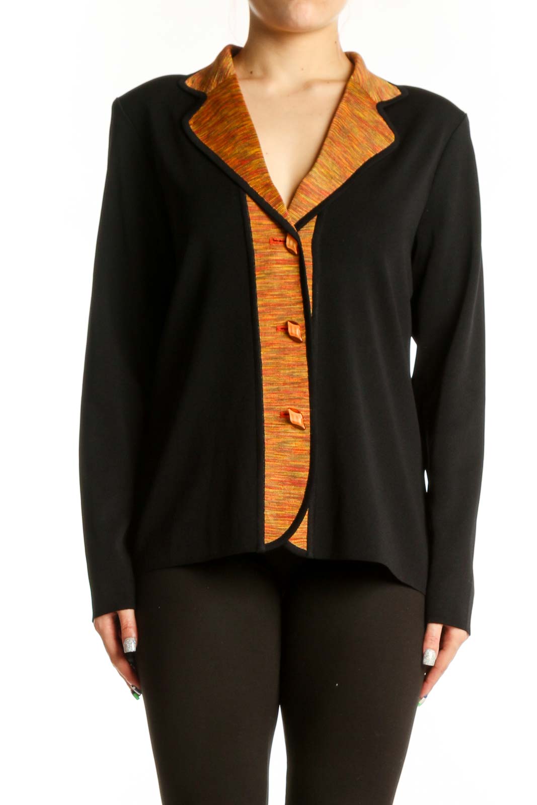 Black acrylic cardigan with orange textured trim and button-front closure, worn on model