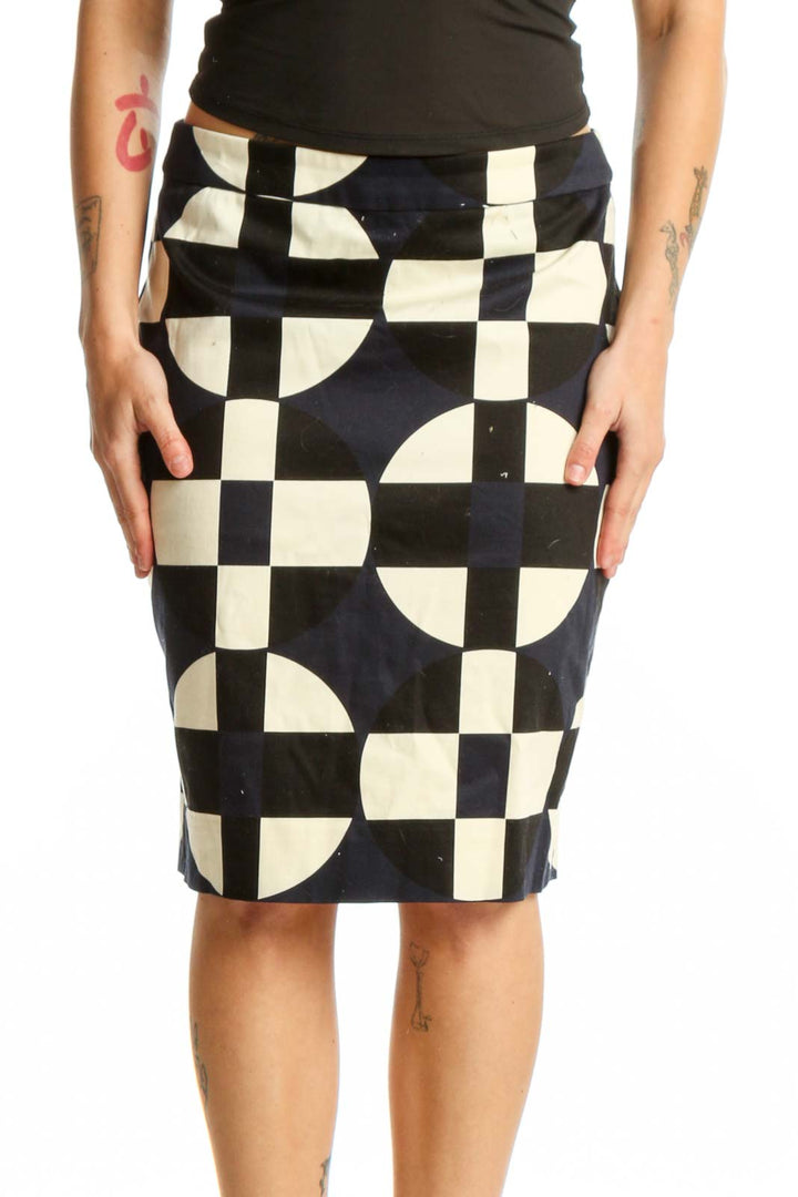 Black and cream checkered pencil skirt with geometric circular motifs, front view