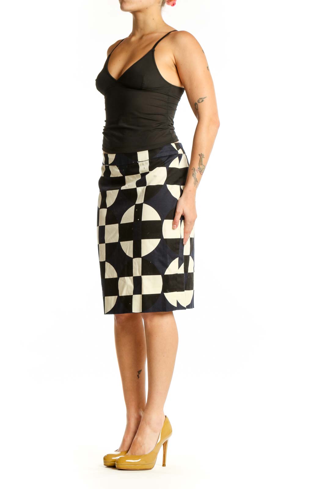 Black and cream checkered pencil skirt with geometric circular motifs, front view