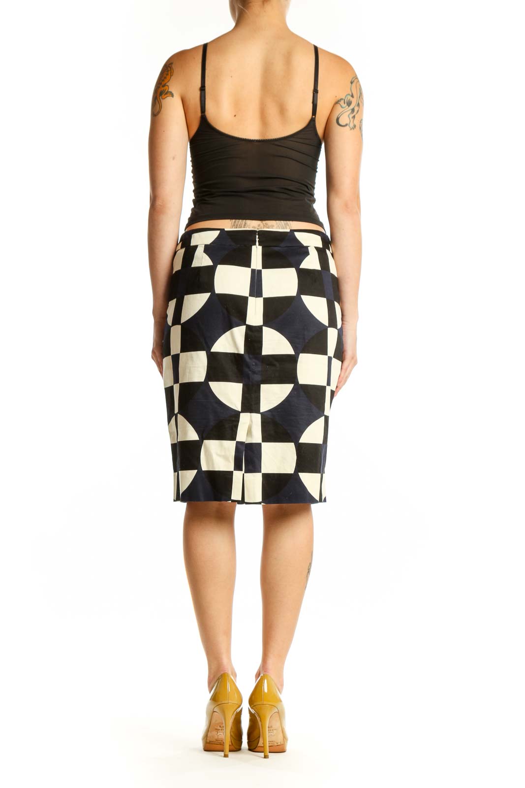 Black and cream checkered pencil skirt with geometric pattern, back view on model