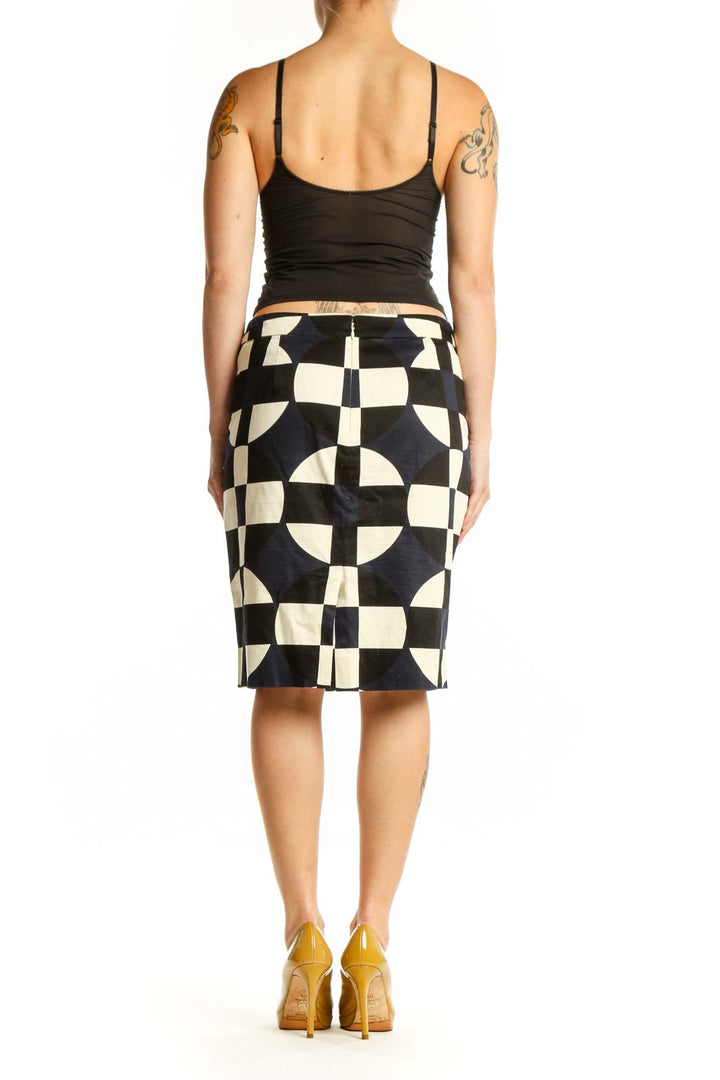 Black and cream checkered pencil skirt with geometric pattern, back view on model