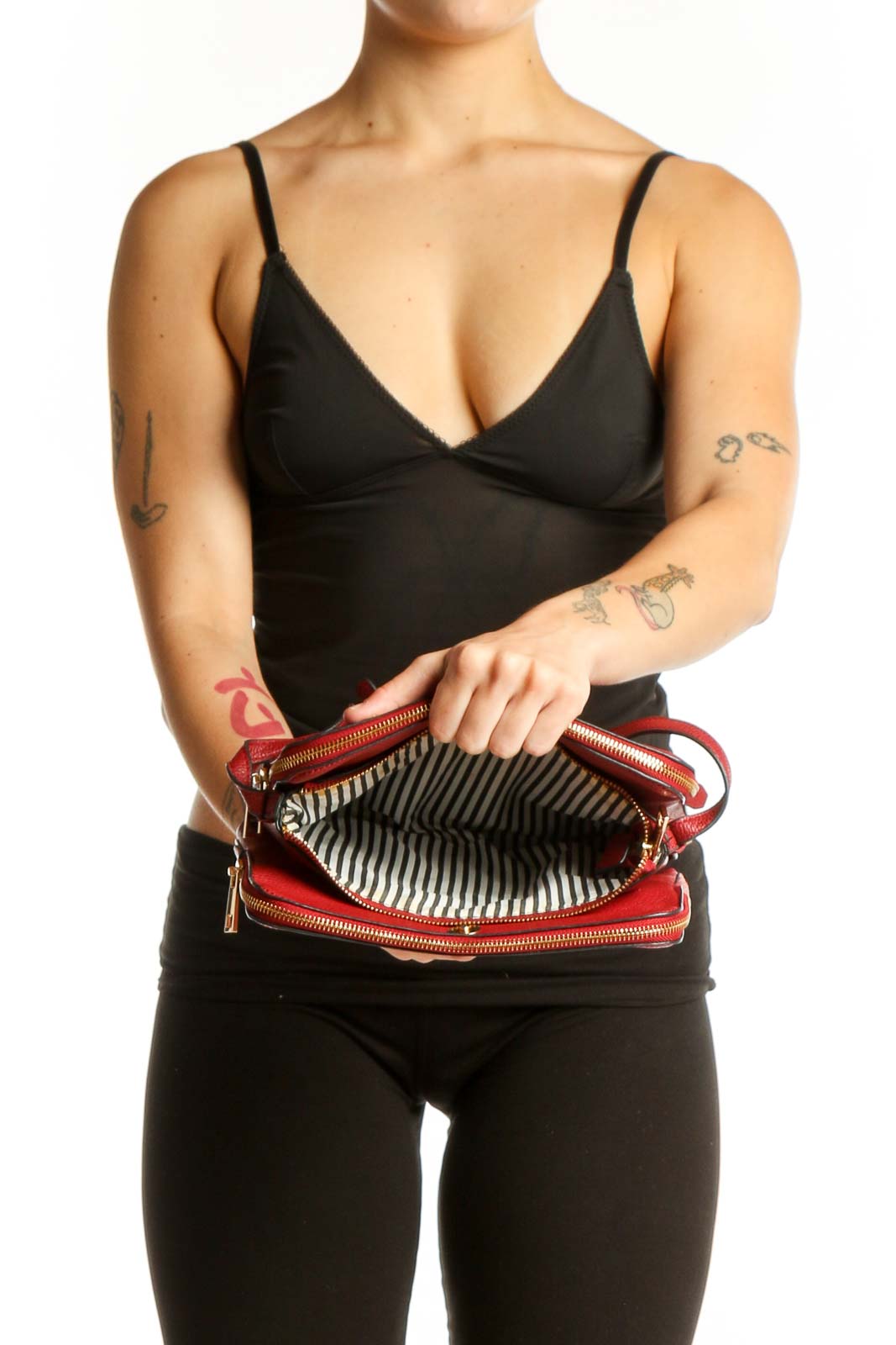 Red leather crossbody bag worn as crossbody style, back view showing strap placement and bag structure