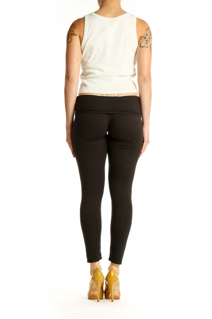 Cream ribbed sleeveless tank top back view, showing fitted silhouette