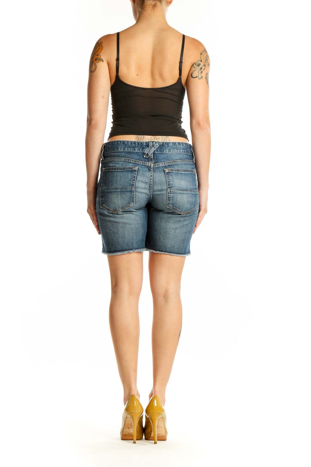 Blue denim distressed shorts back view, showing classic five-pocket styling and fit on model