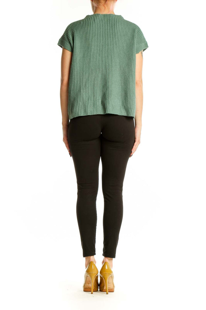 SilkRoll sage green ribbed knit short sleeve top, back view showing relaxed fit and pocket detail