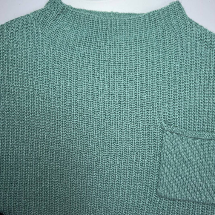 SilkRoll sage green ribbed knit short sleeve top, back view showing relaxed fit and pocket detail