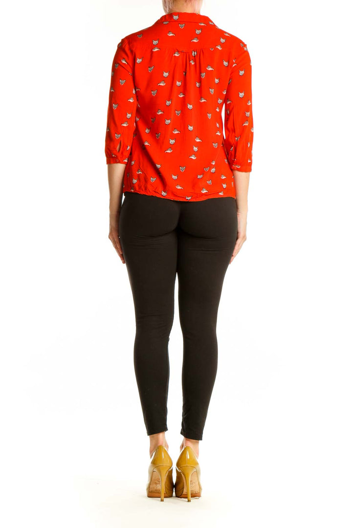 Red cat print button-up blouse with peplum waist detail, back view on model