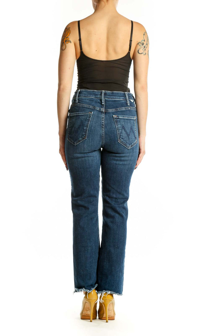 Back view of Mother blue cropped flare jeans showing five-pocket design and flare silhouette