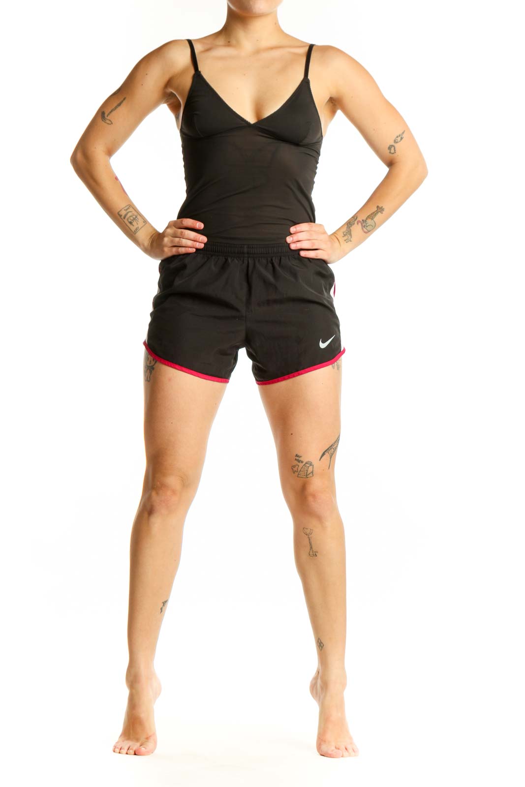 Black Nike athletic shorts with pink trim, front view showing elastic waistband and Nike Swoosh logo