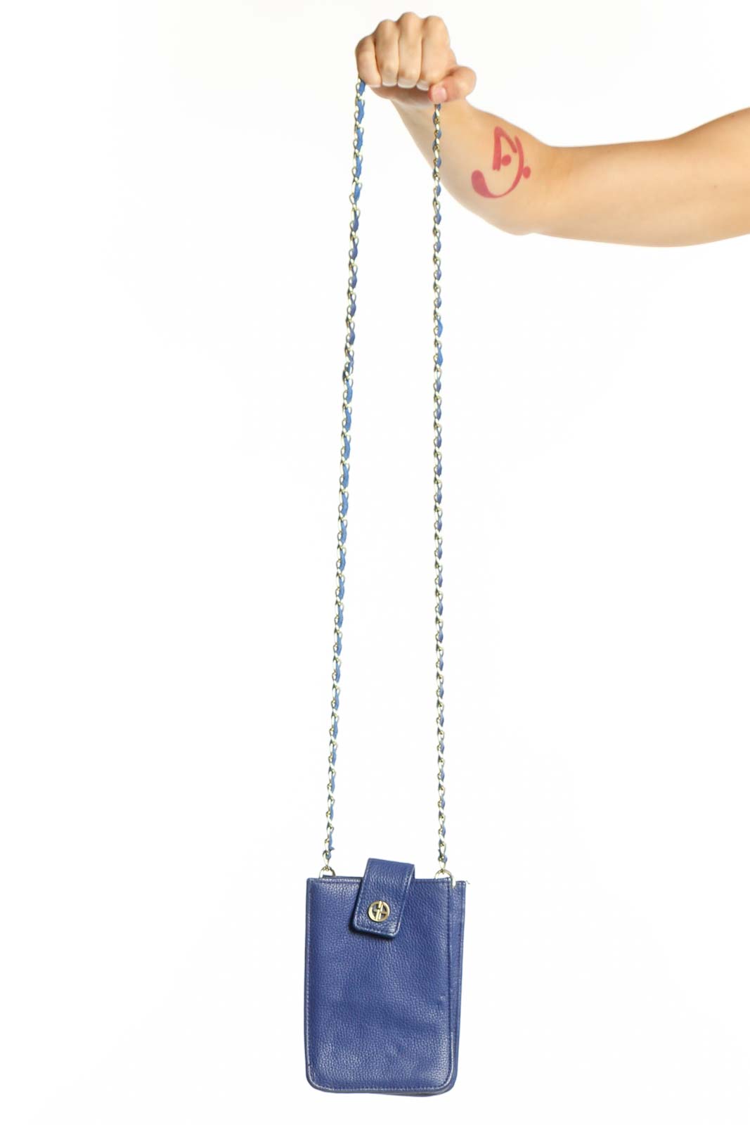 Navy blue Giani Bernini crossbody bag with silver-tone chain strap held in hand