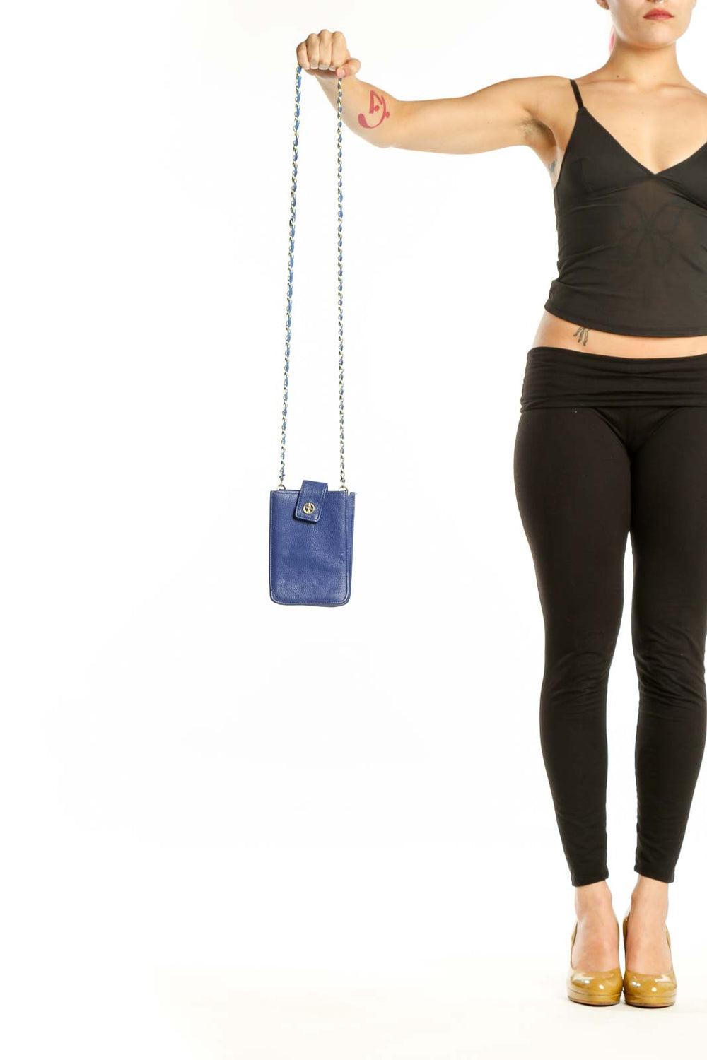 Navy blue Giani Bernini crossbody bag with silver-tone chain strap held in hand