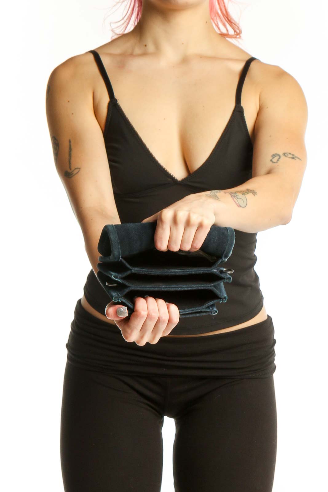 Teal cotton crossbody bag worn as crossbody style on model, showing back view and strap placement