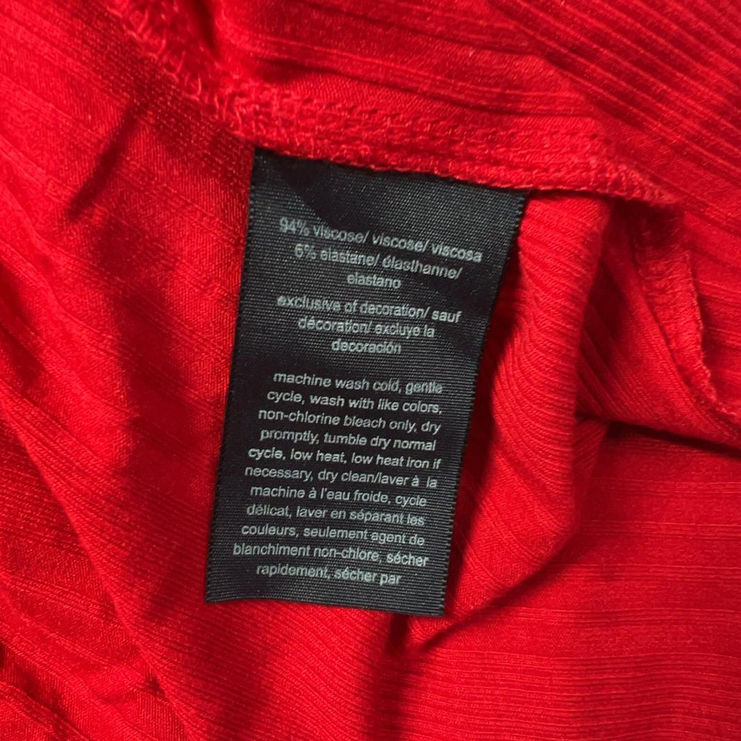 Red maxi t-shirt dress with black trim sleeves by Tommy Hilfiger, back view on model