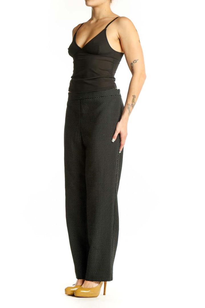 Black polka dot wide-leg pants with elastic waistband, front view
