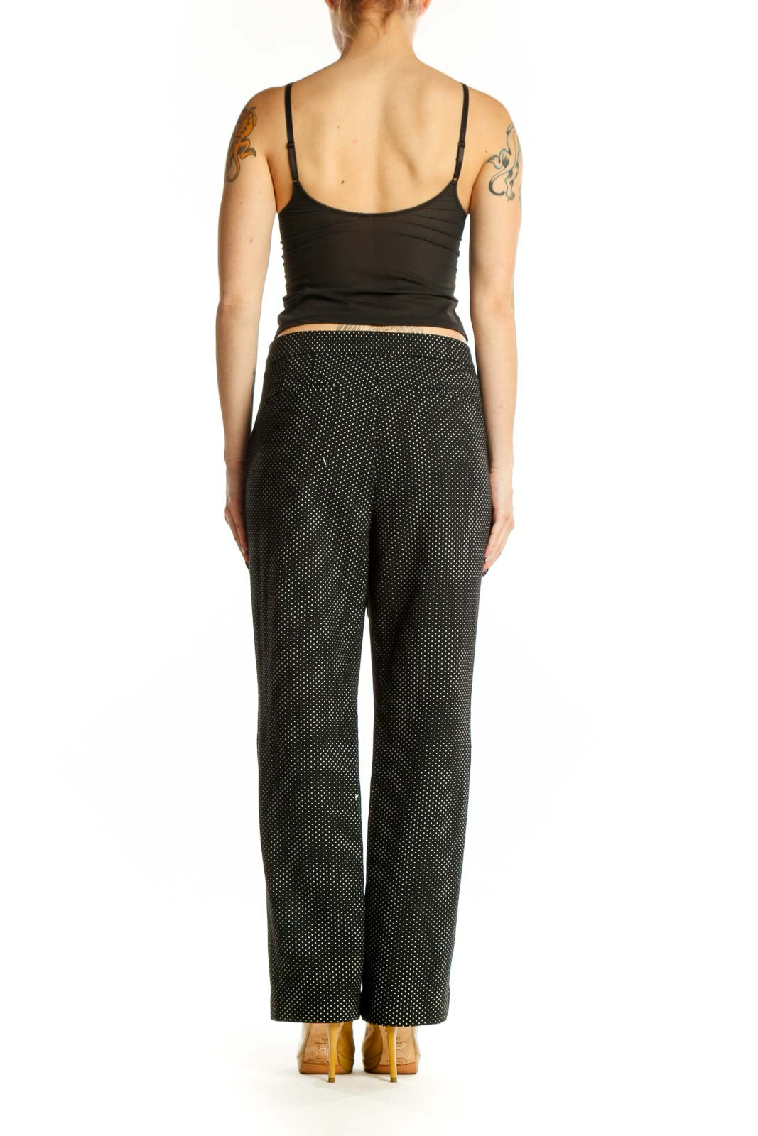 Black polka dot wide-leg pants, back view showing full silhouette