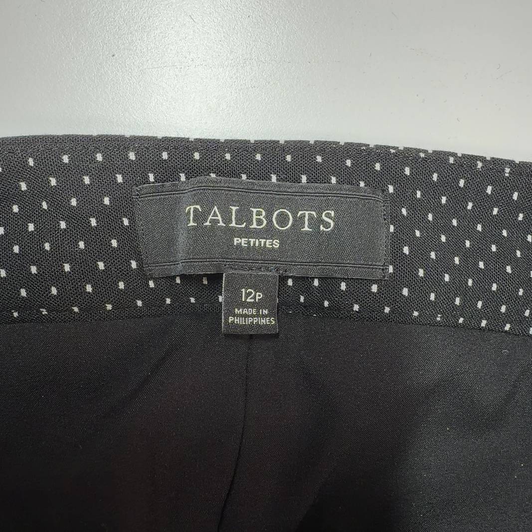 Black polka dot wide-leg pants, back view showing full silhouette