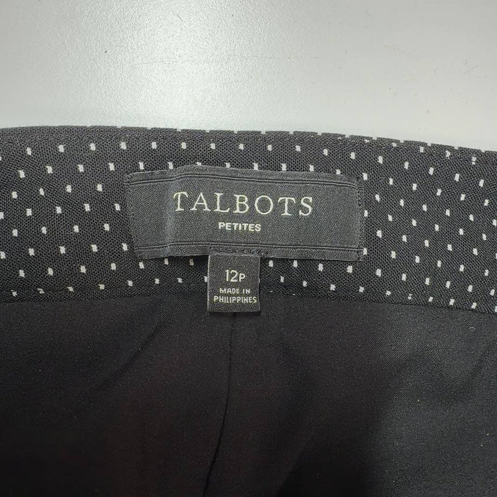 Black polka dot wide-leg pants, back view showing full silhouette