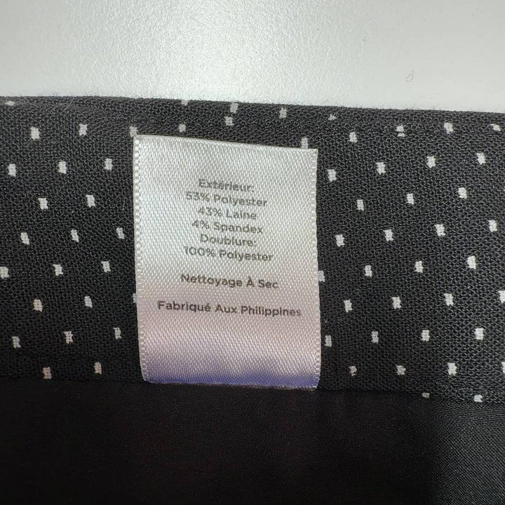 Black polka dot wide-leg pants, back view showing full silhouette