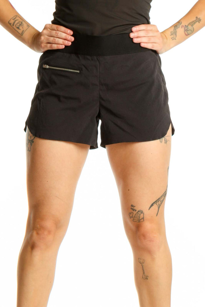 Black Athleta athletic shorts with front zip pocket, high-waisted fit, and side vents, shown from front view