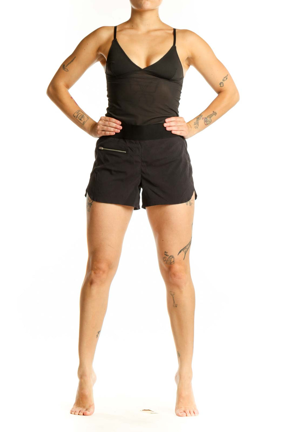Black Athleta athletic shorts with front zip pocket, high-waisted fit, and side vents, shown from front view