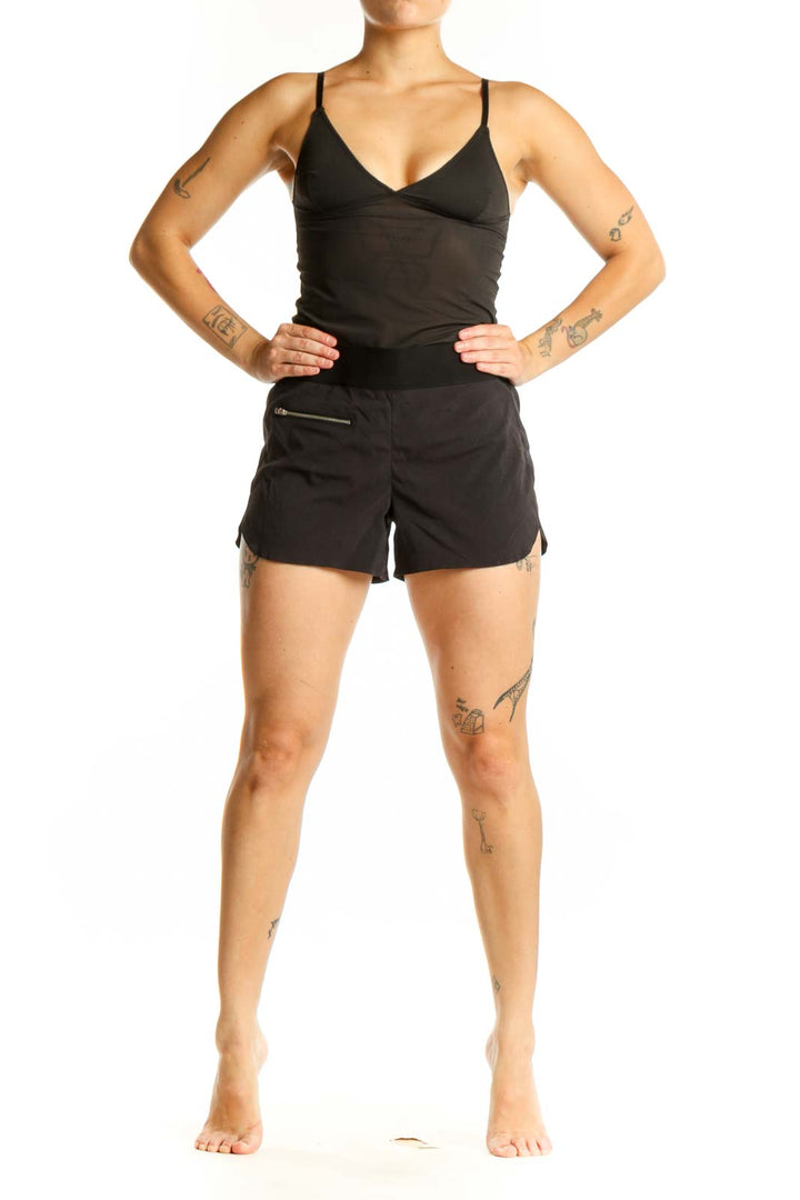 Black Athleta athletic shorts with front zip pocket, high-waisted fit, and side vents, shown from front view