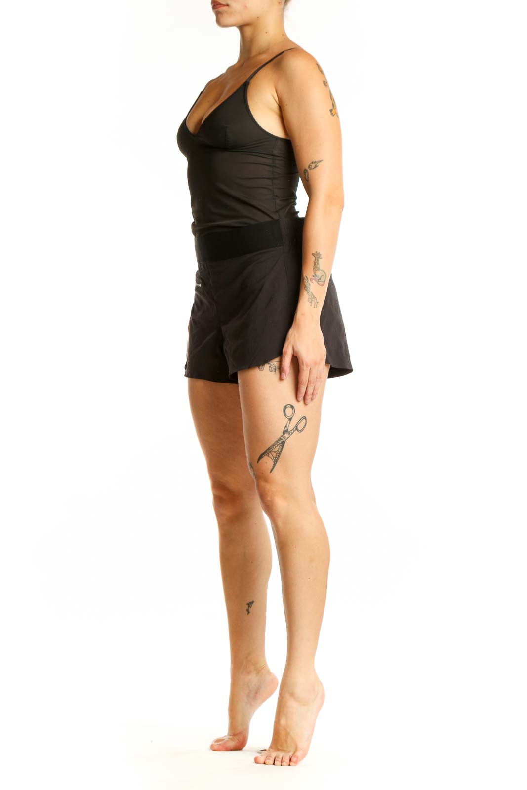 Black Athleta athletic shorts with front zip pocket, high-waisted fit, and side vents, shown from front view