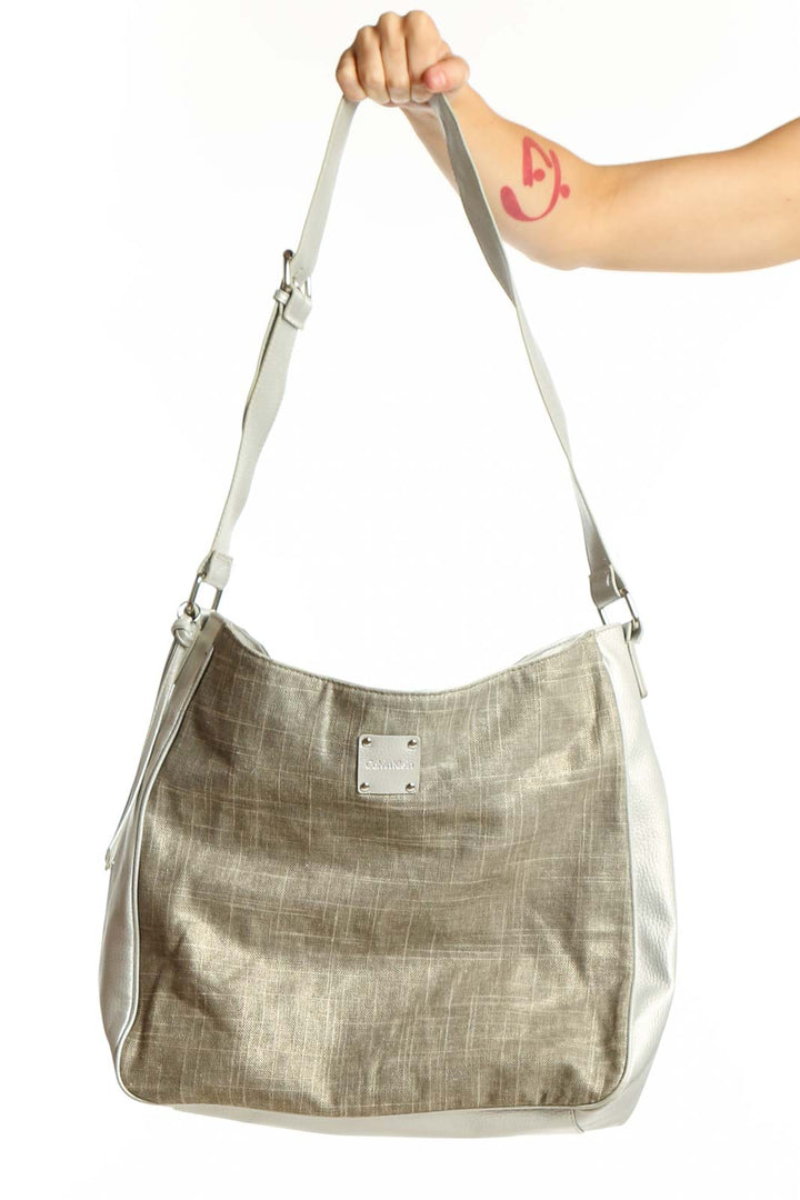 Beige linen Calvin Klein tote bag with white handles and logo patch, front view
