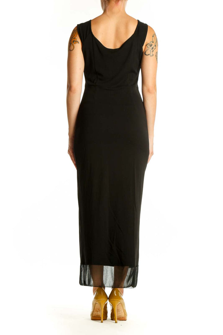 Black sleeveless maxi dress with V-neckline and mesh overlay hem, back view