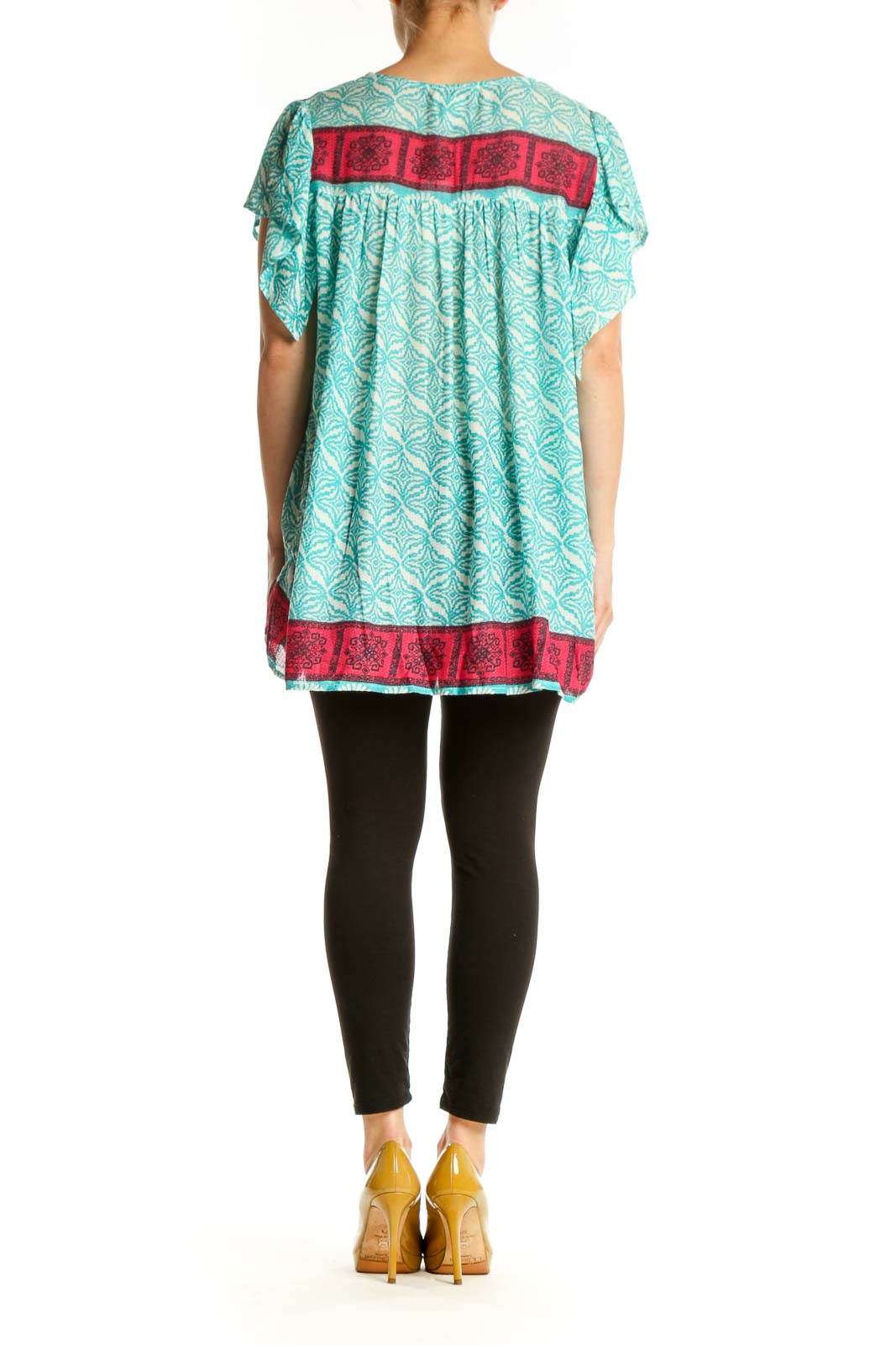 Back view of turquoise floral tunic top showing relaxed fit and pink patterned border hem detail