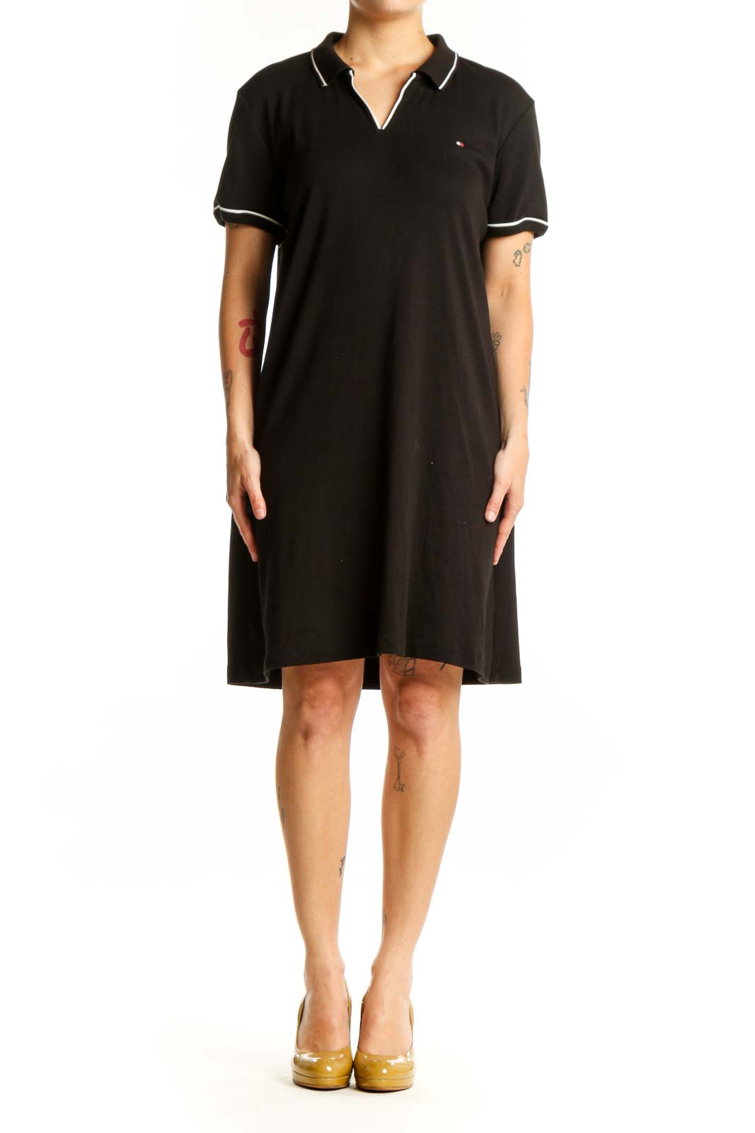 Black cotton polo shirt dress with white-tipped collar and short sleeves, front view
