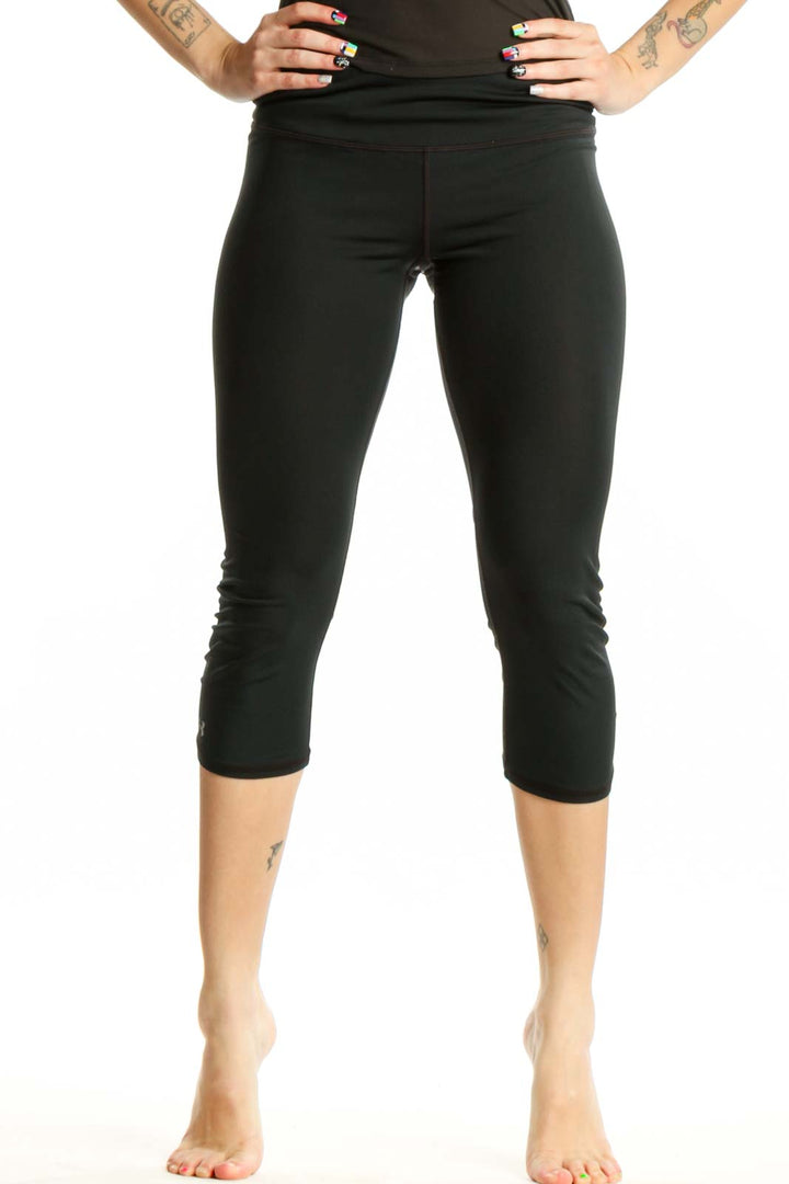 Black capri activewear leggings front view, high-waisted design with form-fitting silhouette