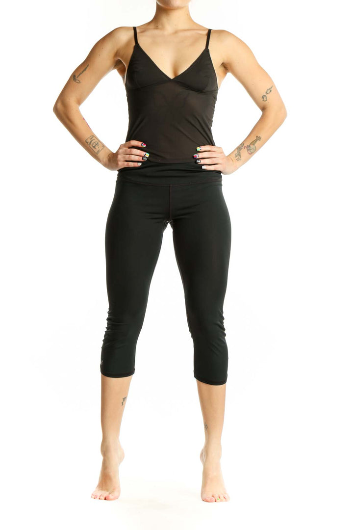 Black capri activewear leggings front view, high-waisted design with form-fitting silhouette